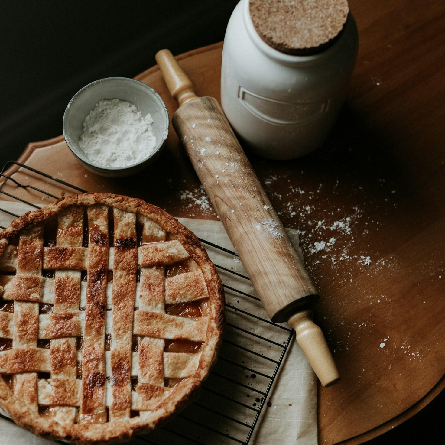 Diverse group of community members sharing a meal together, showcasing the social bonds formed through collaborative cooking